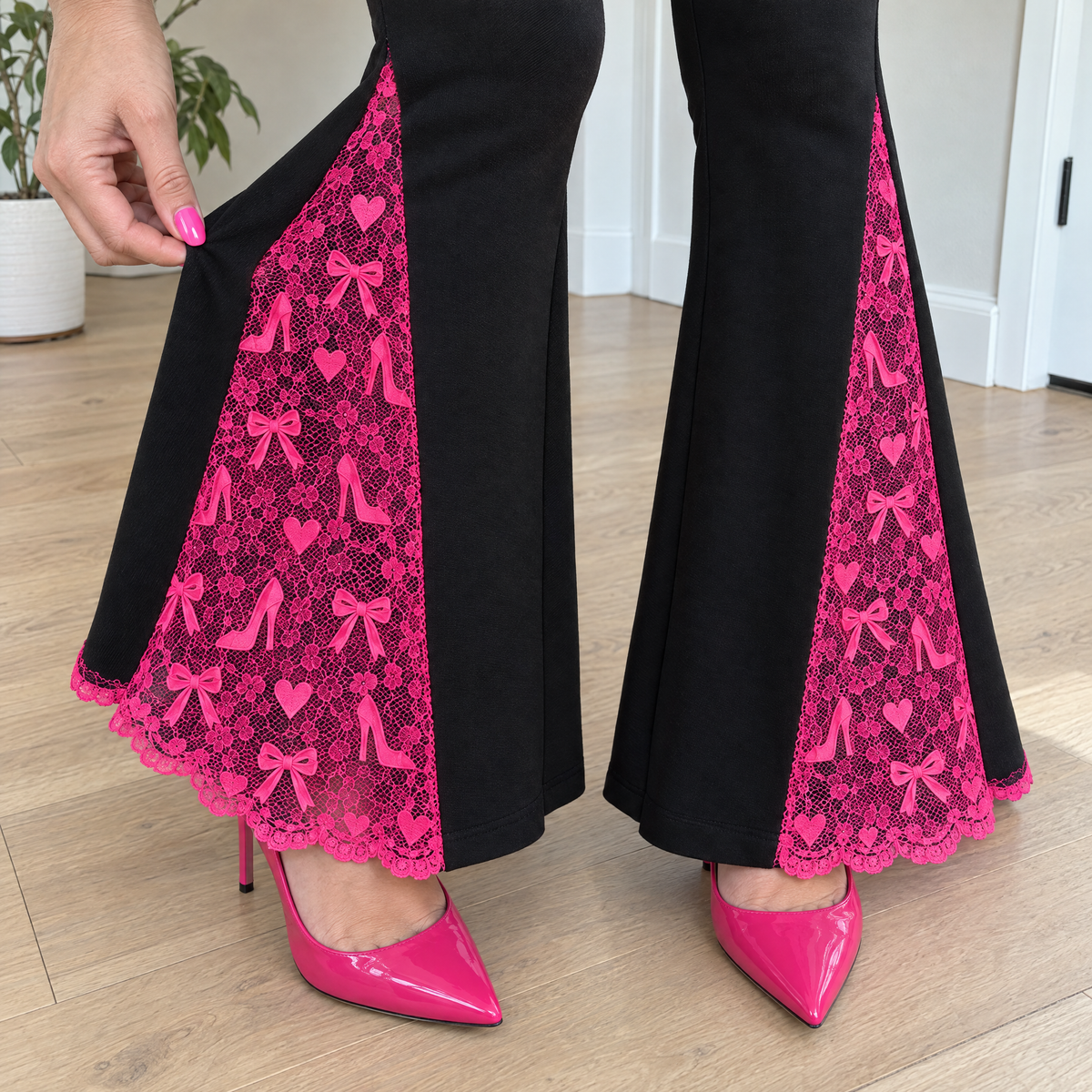 Close-up of the hot-pink lace panel with hearts, bows and tiny heels